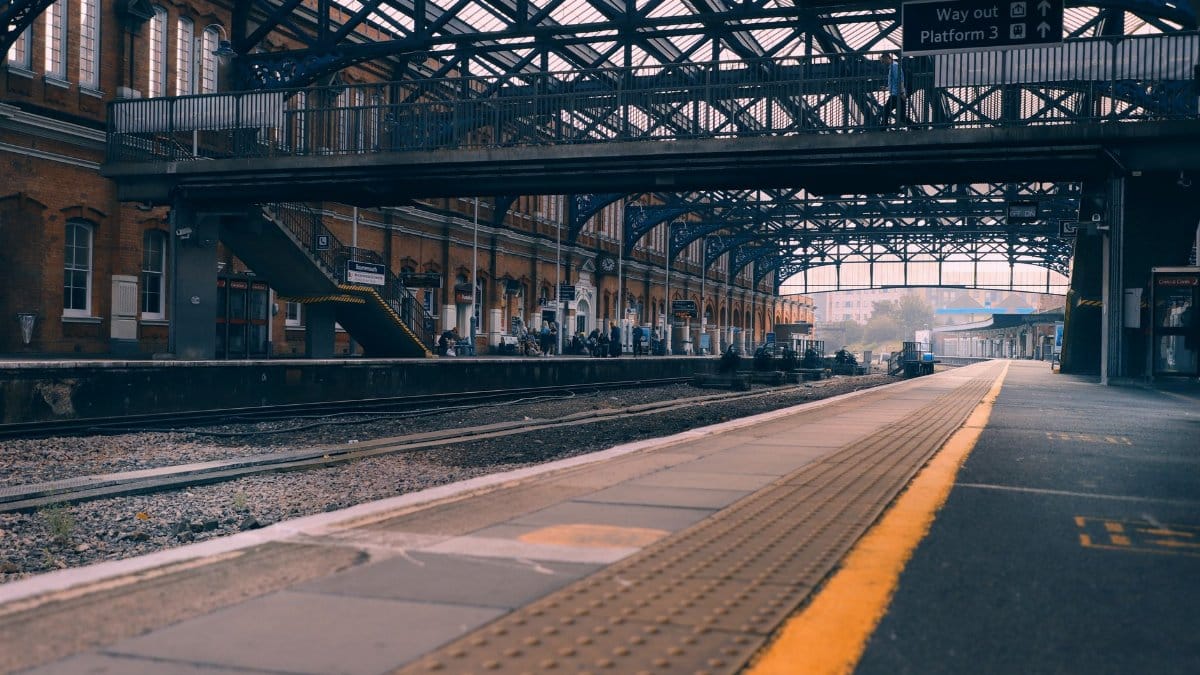 Bournemouth railway station showcasing its architecture and platforms in a tranquil early morning scene.