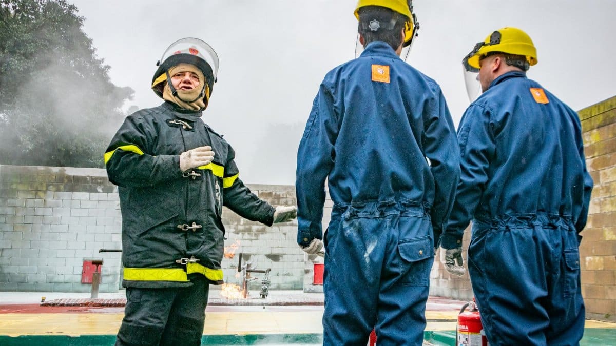 Firefighting team conducting a training session with full safety equipment.