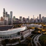 Stunning aerial view of Chicago's skyline and Soldier Field during sunset.
