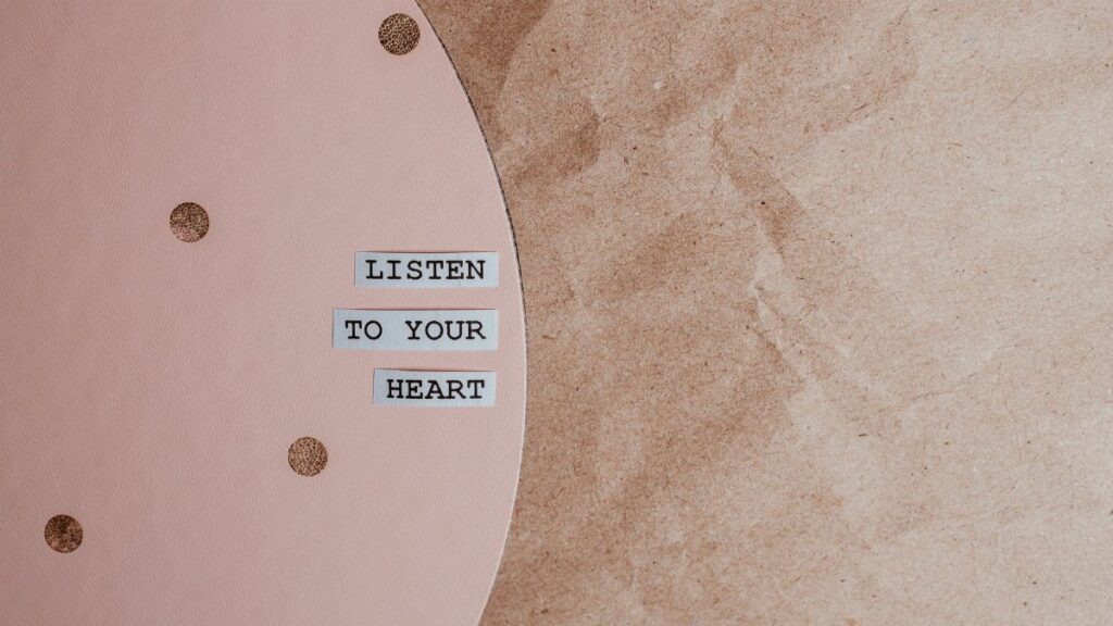 Motivational quote 'Listen to your heart' on a stylish pink and brown textured background.