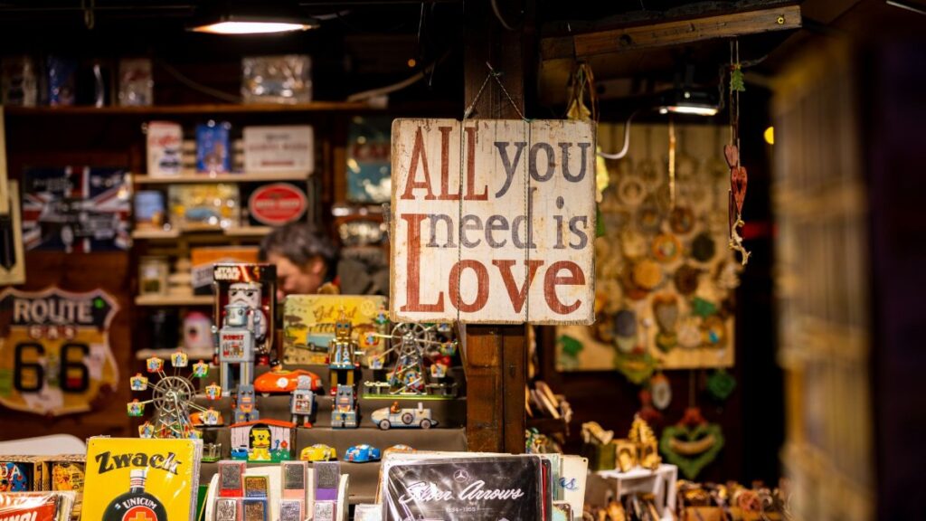 A charming vintage market stall featuring retro items and a "Love" sign.