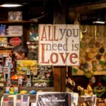 A charming vintage market stall featuring retro items and a "Love" sign.
