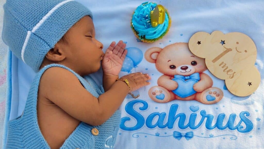Adorable baby sleeps next to a cupcake, marking their first month milestone. Perfect for newborn themes.