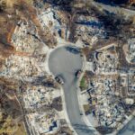 Aerial view of Santa Rosa neighborhood devastated by Tubbs Fire. Burned homes visible.