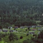 Explore the remains of an abandoned mining town nestled in a lush Colorado mountain valley.