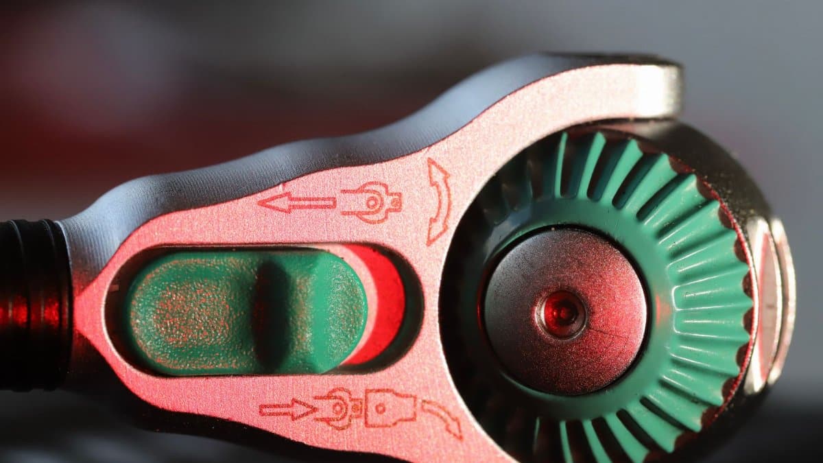 Detailed close-up of a mechanical gauge knob with indicators.