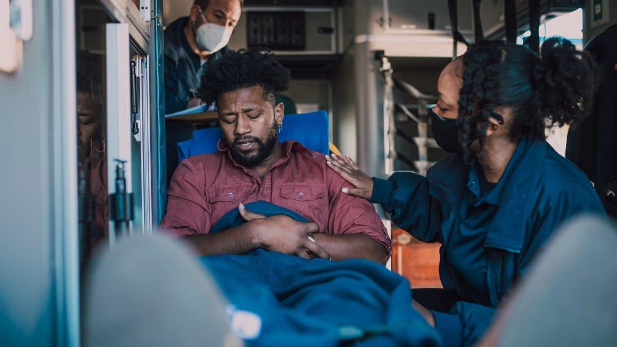 Paramedics provide emergency care to a patient inside an ambulance, ensuring timely medical attention.