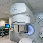 High-tech radiotherapy machine in a hospital setting, essential for cancer treatment.