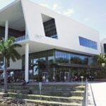 Contemporary architecture at the University of Miami campus with vibrant student life and lush surroundings.