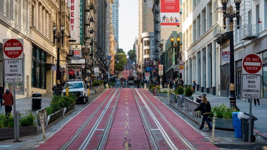 Vibrant street view of San Francisco with people, shops, and iconic signs.