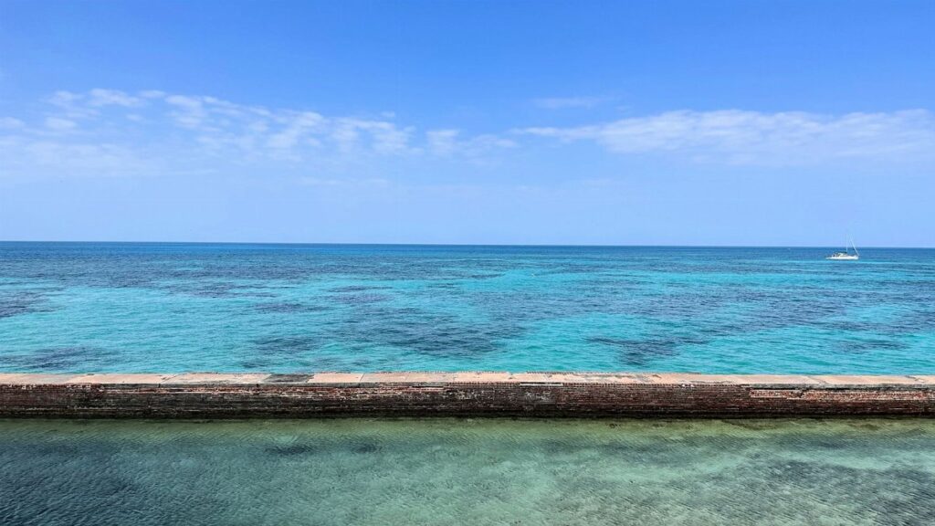 Tranquil turquoise ocean and sky at Key West, Florida. Perfect for relaxation and travel inspiration.
