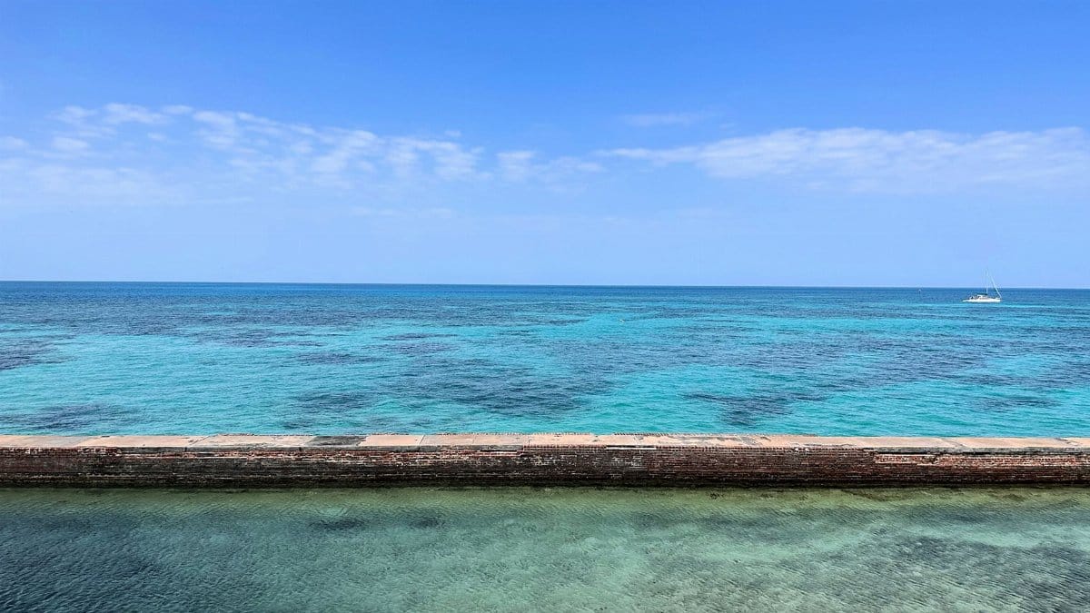 Tranquil turquoise ocean and sky at Key West, Florida. Perfect for relaxation and travel inspiration.