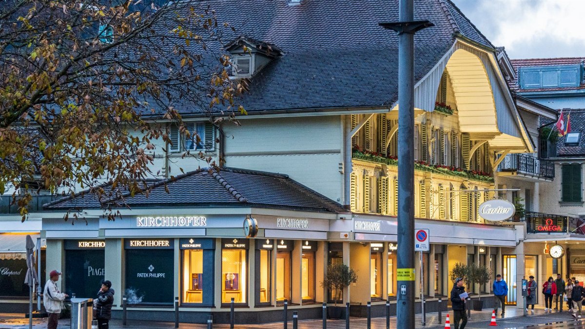 Explore the elegant Kirchhofer and Cartier watch stores in Interlaken, Switzerland.