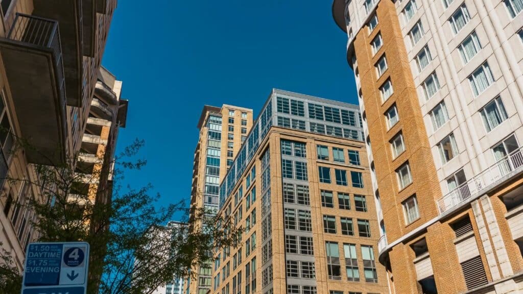 High-rise buildings in Baltimore against a clear blue sky with urban vibes.