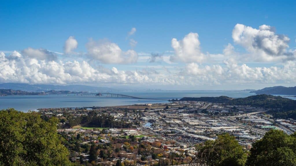 Aerial view of the Bay Area landscape with a vibrant sky and harbor.