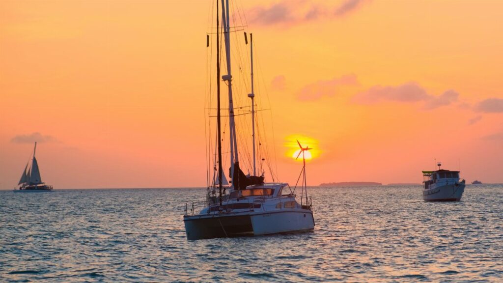 Peaceful sunset scene of sailboats in Key West waters, Florida.