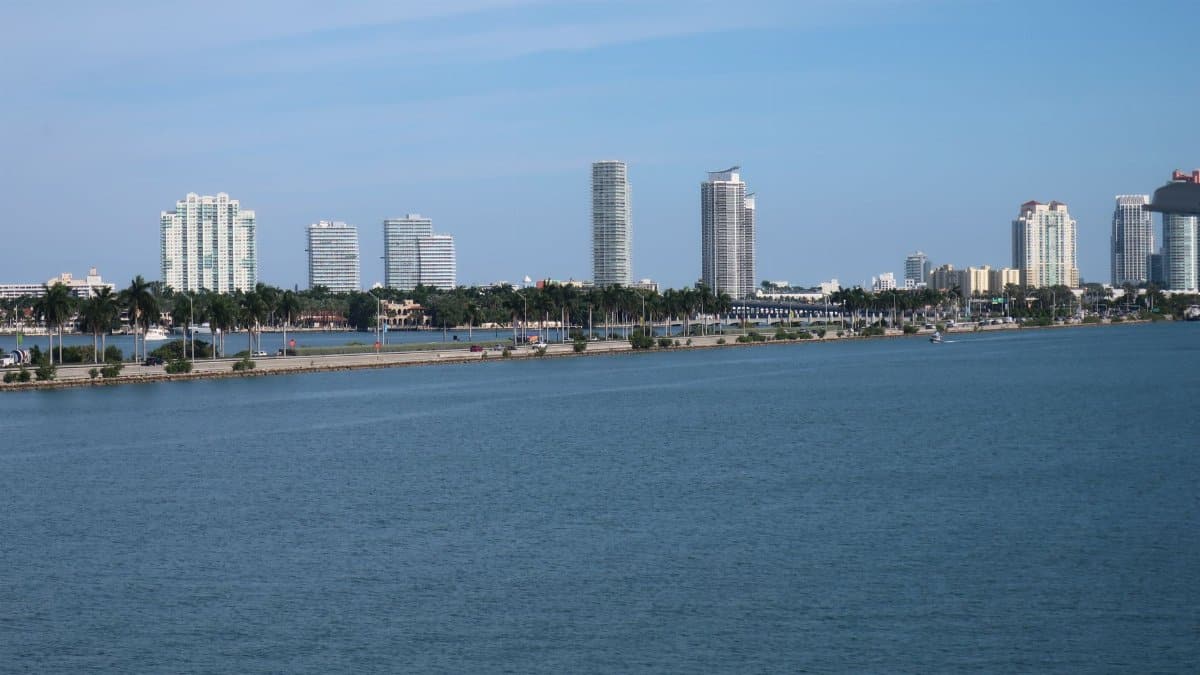 Serene view of Miami Beach skyline with skyscrapers and waterfront.