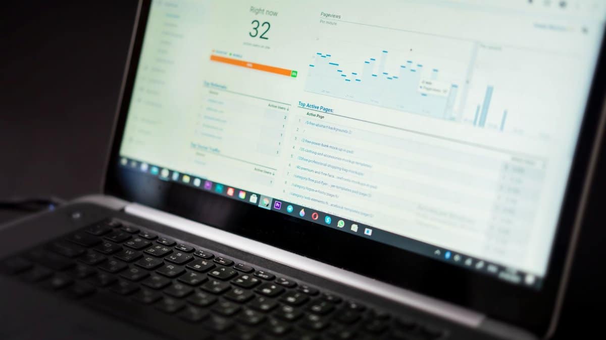 A laptop displaying an analytics dashboard with real-time data tracking and analysis tools.