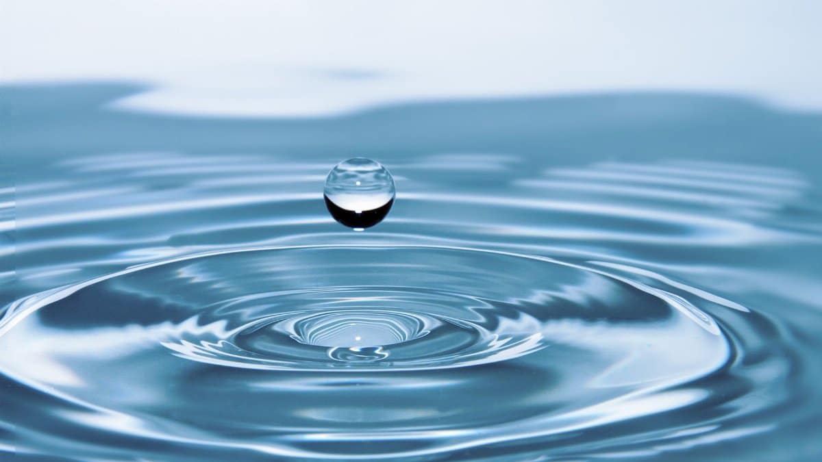 A mesmerizing shot of a water droplet capturing the beauty of liquid dynamics.