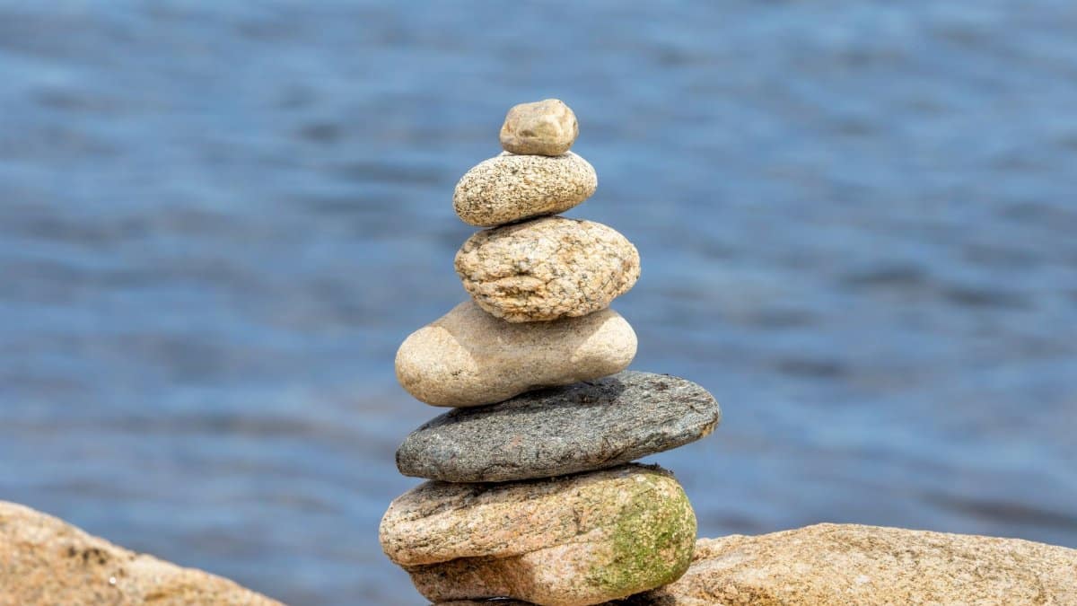 Serene stone stack by the seaside, evoking tranquility and balance.