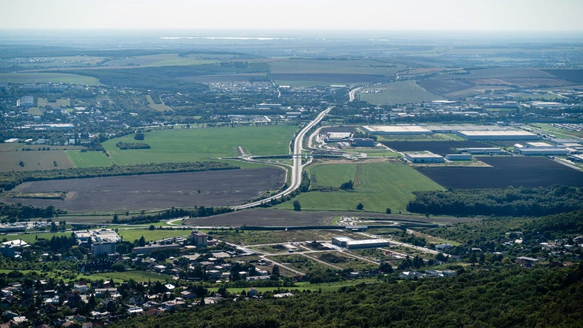 A breathtaking aerial view of Nitra cityscape with rural surroundings on a sunny day.