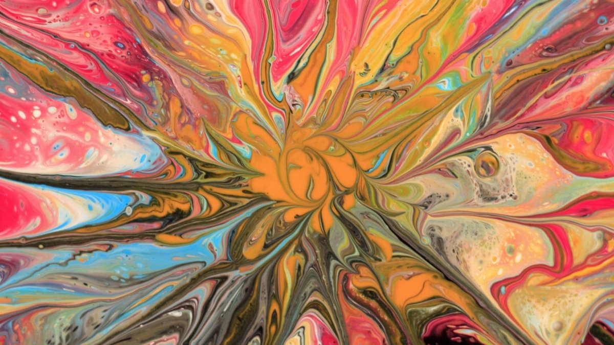 A vivid, abstract swirl of bold colors creating an eye-catching artistic pattern.