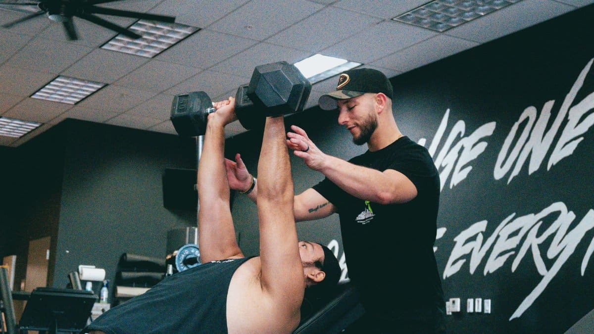 Indoor personal training session focusing on strength training and core workout.