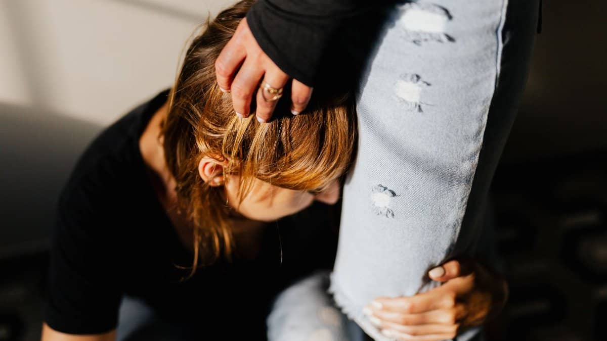 Emotional support between two women captured in a candid moment, highlighting intimacy and empathy.
