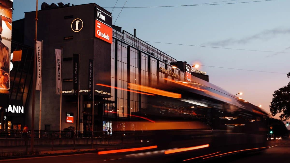 A dynamic view of moving traffic at dusk along the streets of Riga, Latvia.