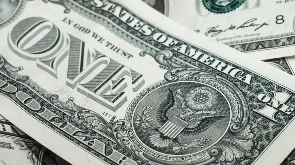 Detailed macro shot of a United States one dollar bill showing various design elements.