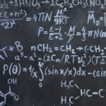 Intricate mathematical and chemical equations chalked on a blackboard symbolizing education and science.