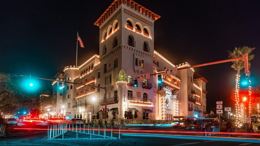 Long exposure of Casa Monica Hotel in St. Augustine, Florida, during festive night with bright lights.
