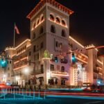 Long exposure of Casa Monica Hotel in St. Augustine, Florida, during festive night with bright lights.