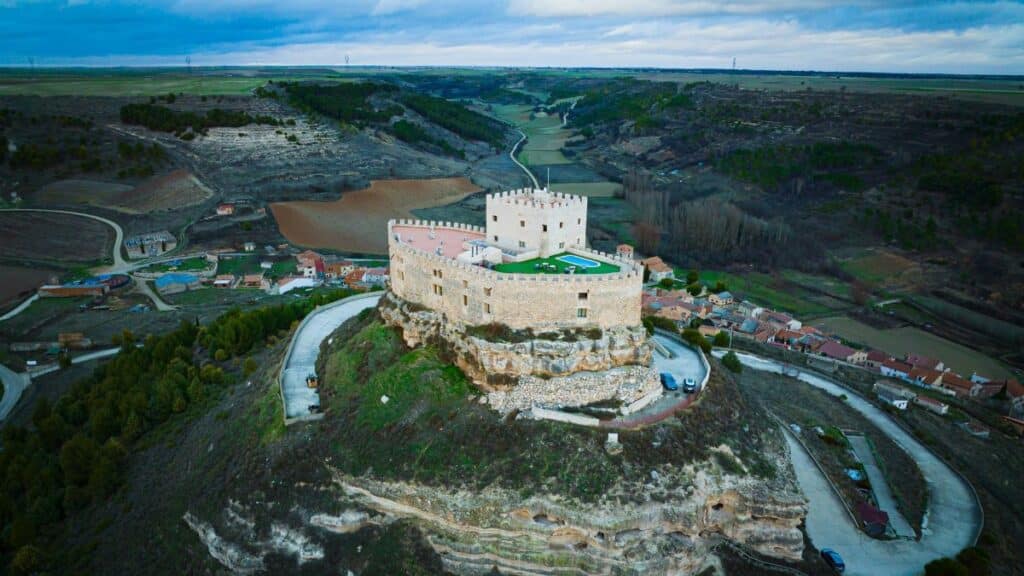 Explore the iconic Curiel de Duero Castle set in the scenic landscape of Castilla y León, Spain.