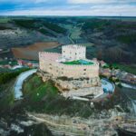 Explore the iconic Curiel de Duero Castle set in the scenic landscape of Castilla y León, Spain.