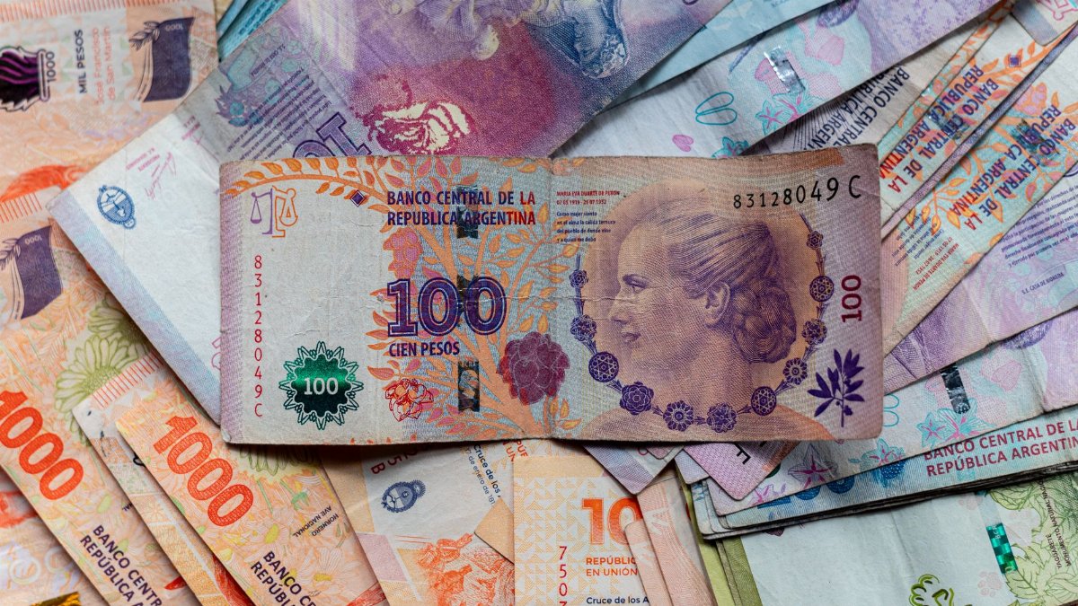 A collection of colorful Argentinian peso bills, featuring diverse denominations and designs.