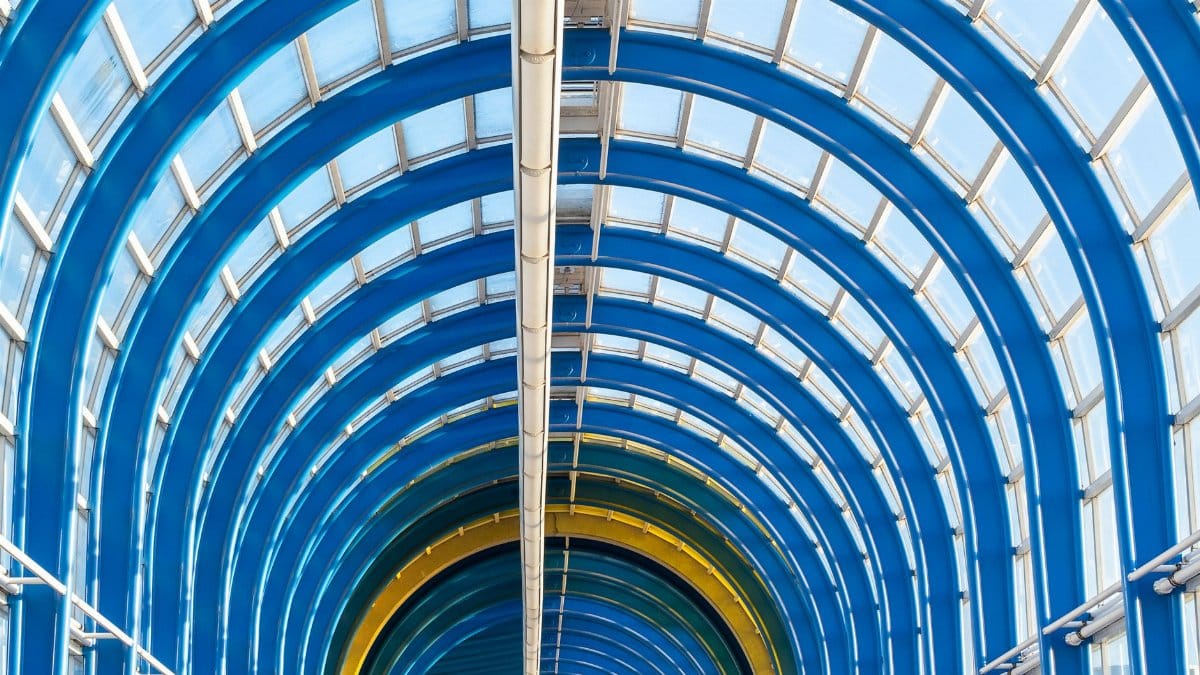 Dynamic view of a vibrant arched ceiling in Zoetermeer, Netherlands. Bright and modern design.