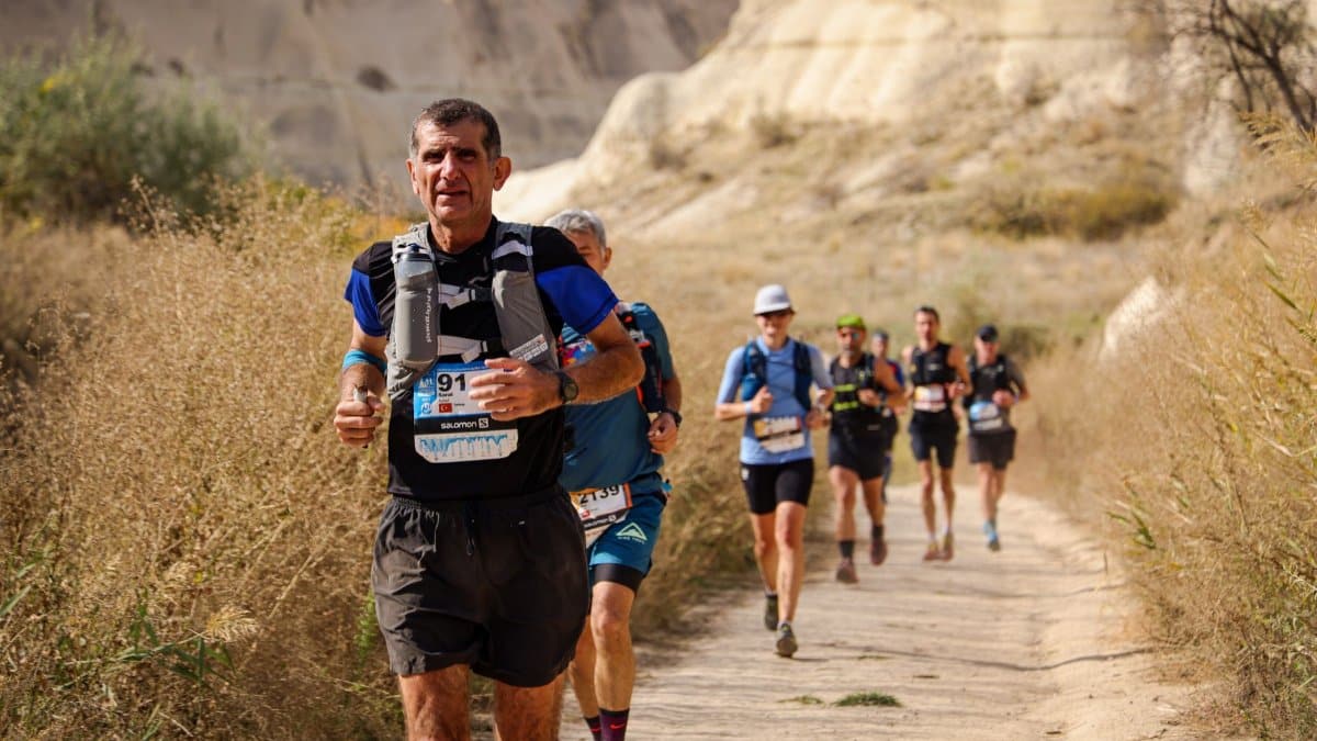 Runners participating in an exciting outdoor trail marathon on a sunny day.