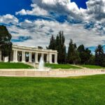 Beautiful pavilion and fountain in Cheesman Park, Denver, under a vibrant summer sky.