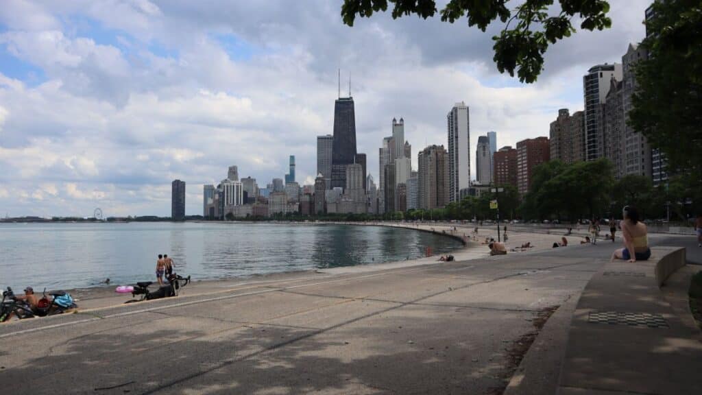 View of Chicago skyline with Lake Michigan from North Avenue Beach on a cloudy day.