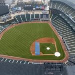 Empty Guaranteed Rate Field in Chicago captured from above, showcasing the lush green baseball field and seating areas.