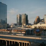Aerial view of downtown Austin, Texas showcasing modern skyscrapers and urban infrastructure at dusk.
