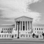Classic view of the US Supreme Court building in Washington, D.C., highlighting neoclassical architecture.