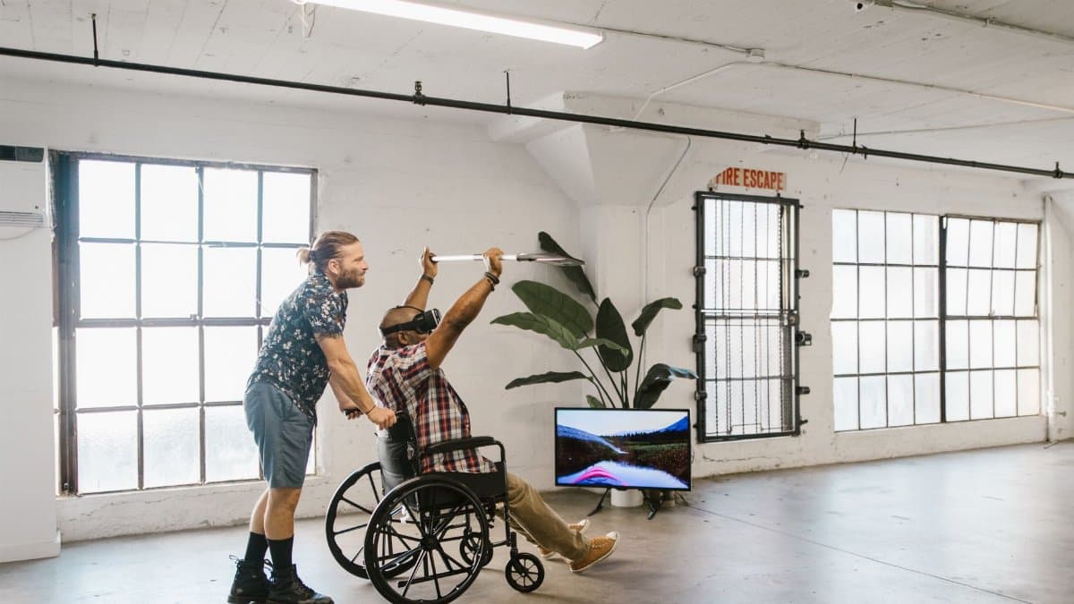 A diverse group engages in virtual reality indoors for rehabilitation and fun.
