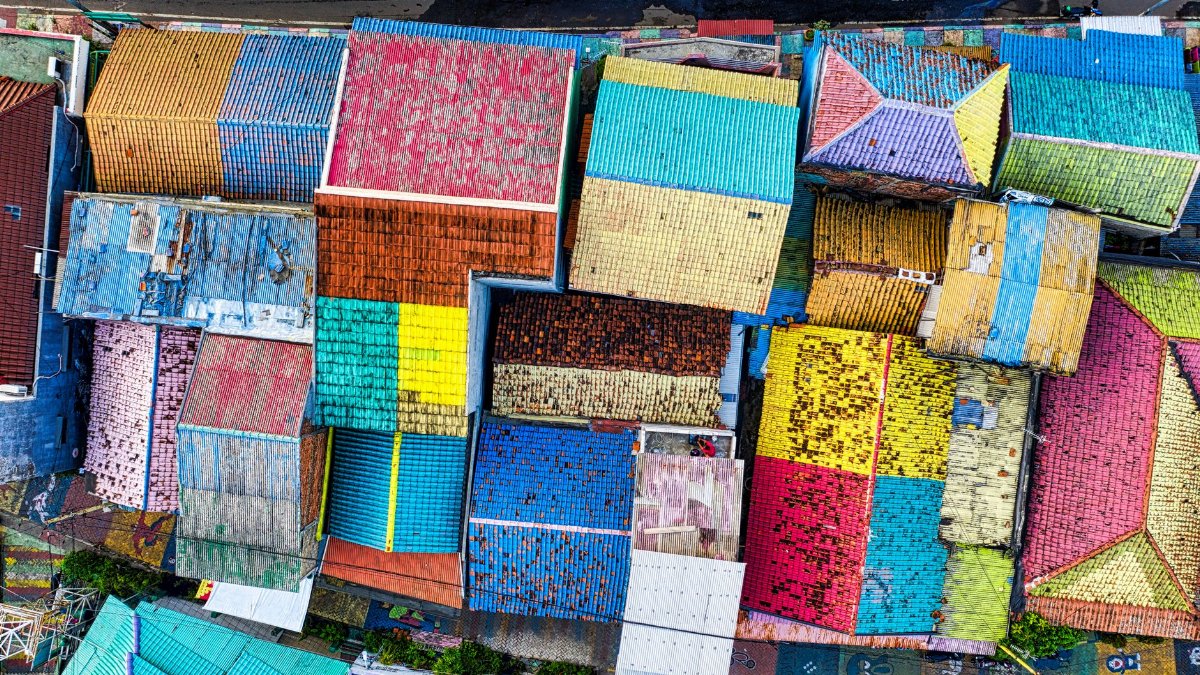 Aerial view of colorful rooftops in Tangerang, Banten, Indonesia showcasing vibrant city life.