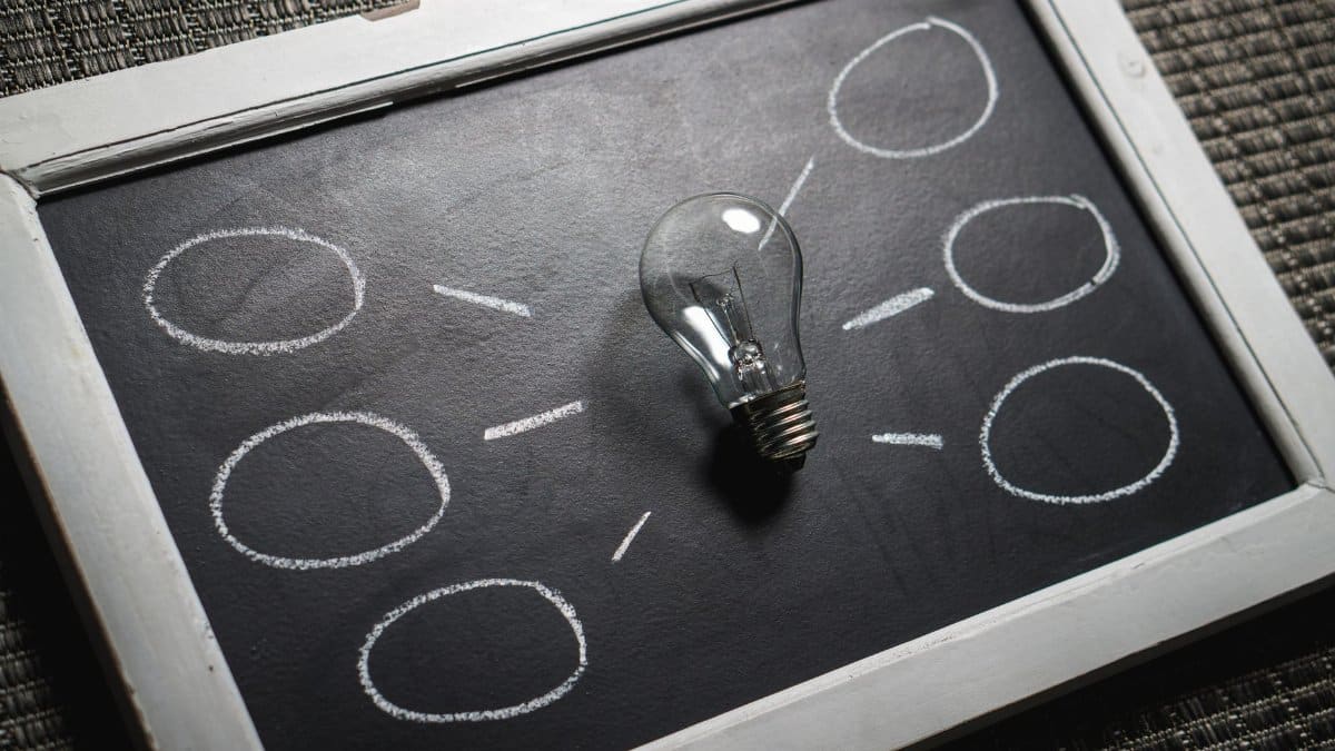 Chalkboard with a light bulb symbolizing ideas and creativity. Perfect for education themes.