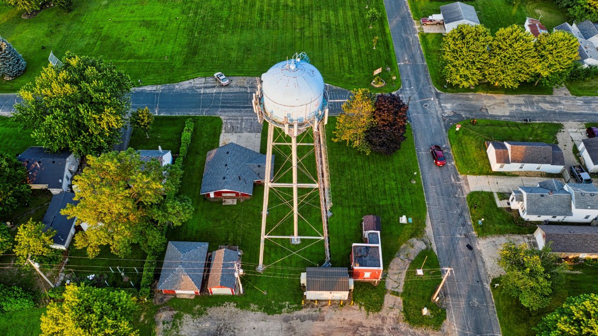 Aerial photograph showing the water tower and nearby residential area in Austin, Minnesota.