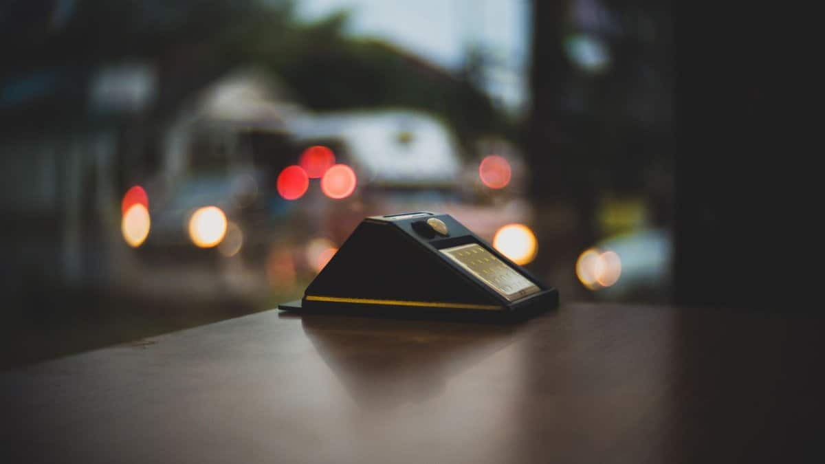 An artistic long exposure shot capturing street lights bokeh and a focus on a table ornament.