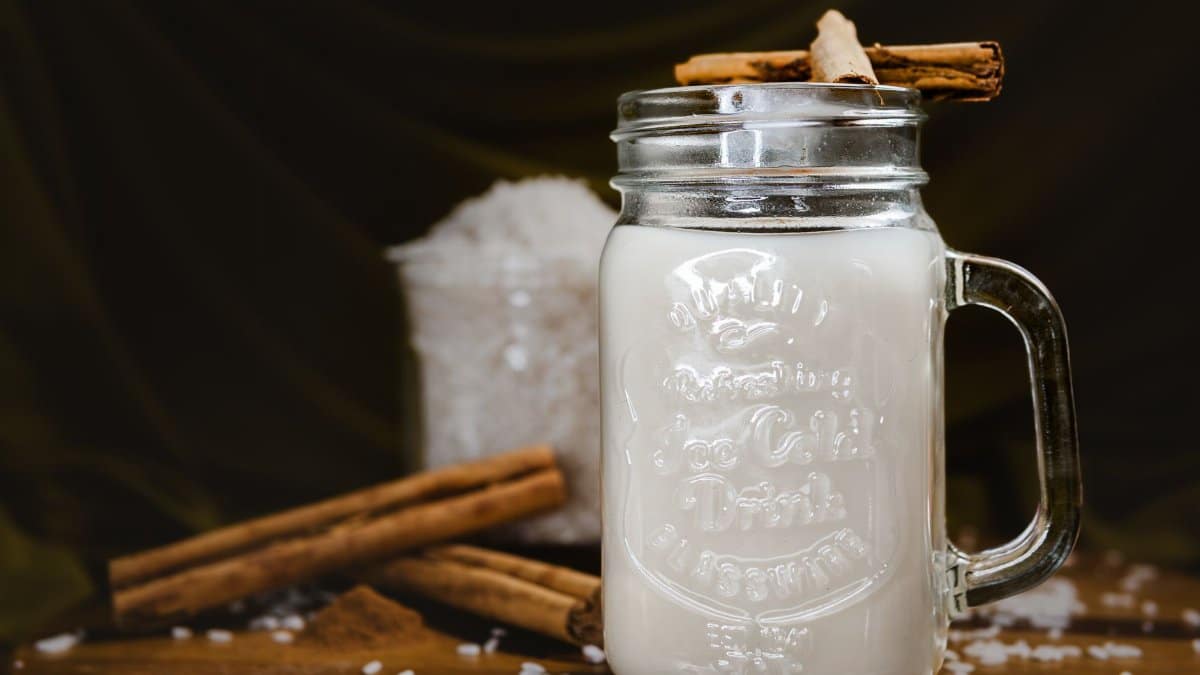 Refreshing traditional Mexican horchata served in a mason jar with cinnamon sticks.