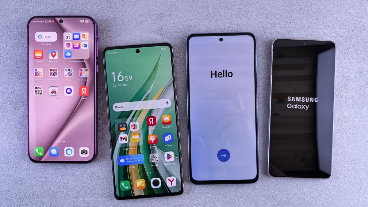 Four modern smartphones showcasing home screens, applications, and startup logos on a sleek surface.